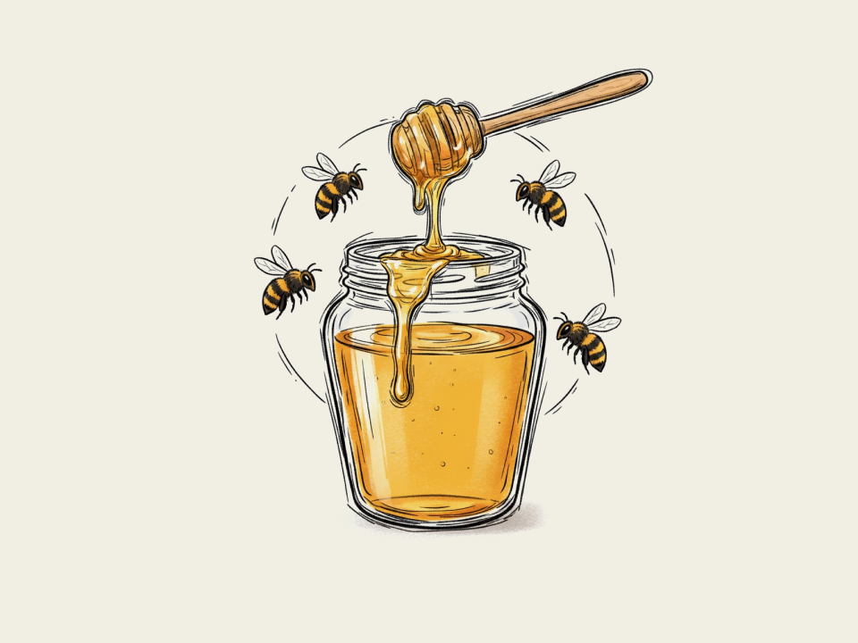 Un vasetto di miele con delle api